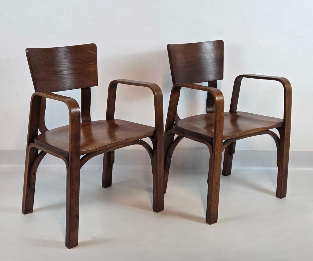 PAIR OF MID-CENTURY BENTWOOD ARMCHAIRS IN THE MANNER OF THONET (1 of 3): A pair of Mid-Century Modern armchairs featuring steam-bent wood construction. Approximate Dimensions: 32.5"h x 21.75"w x 20.5"d Artist or Maker: Unknown Provenance: From a New York Collec