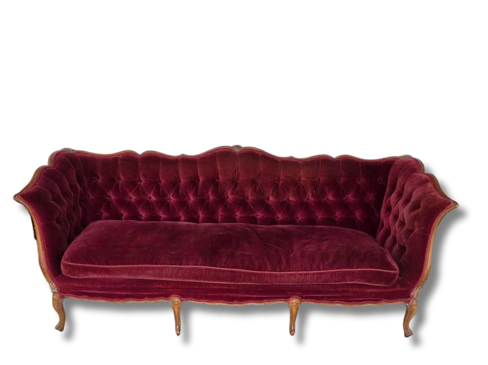 LOUIS XV STYLE TUFTED VELVET SOFA: An elegant, carved wood frame settee with a tufted backrest and out-swept arms upholstered in a rich, burgundy velvet on cabriole legs. Approximate Dimensions: 35.5"H x 86.5"W x 33"D Artis
