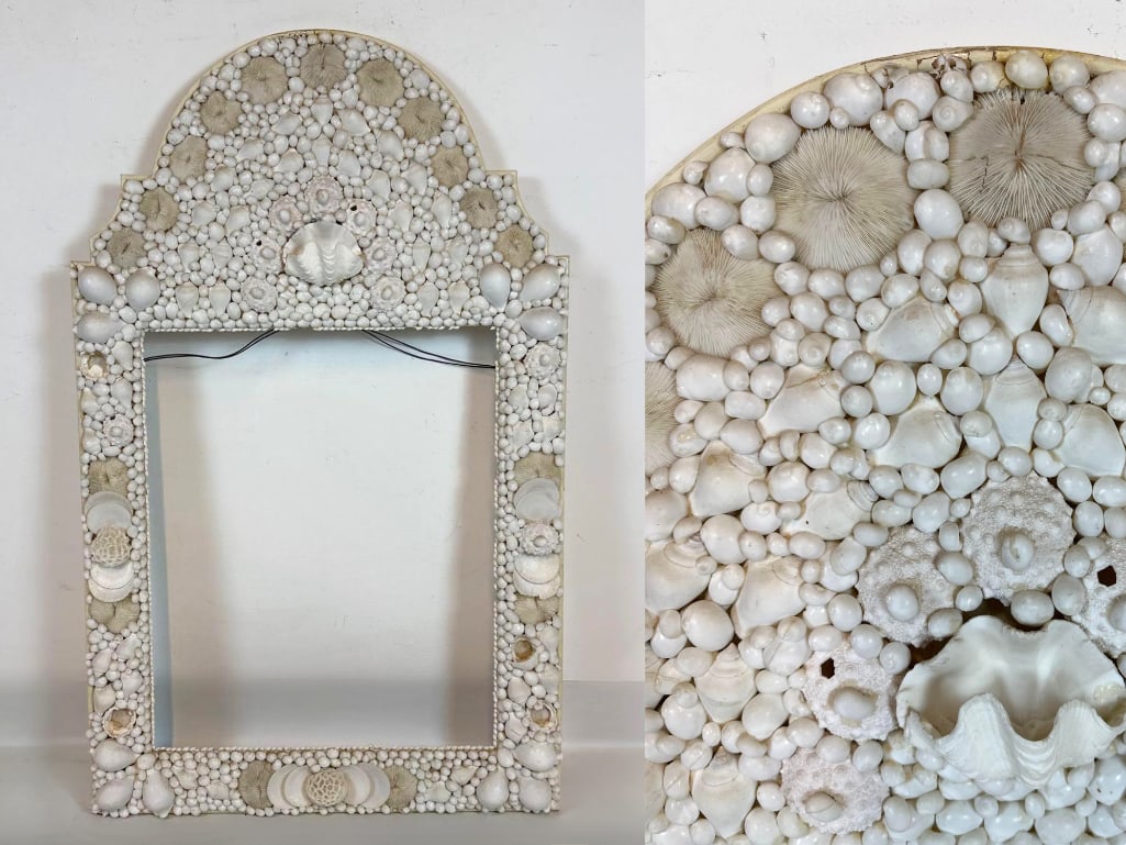 VINTAGE HOLLYWOOD REGENCY WHITE SEA SHELL AND STONE MOSAIC ARCHED WALL FRAME: Vintage Hollywood Regency style rectangular picture or mirror frame topped with an arched cresting and entirely encrusted in a multi-textured mosaic of varied sea shells and stones. Approximate Dimens