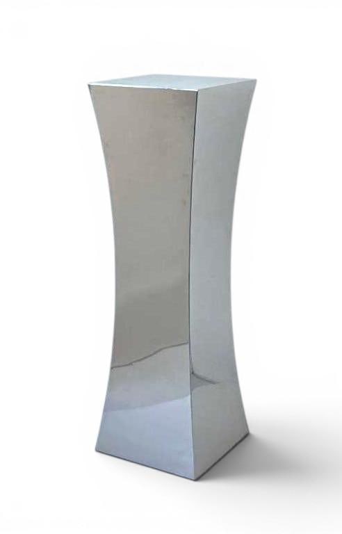 MEGARON CHROME MIRRORED PEDESTAL PLINTH SIGNED (1 0F 2): A postmodern, minimalist rectangular curved column display pedestal clad in multi-panel mirrored chrome. Signed. Approximate Dimensions: 43.5"H x 13.75"W x 13.75"D Maker: Megaron Provenanc