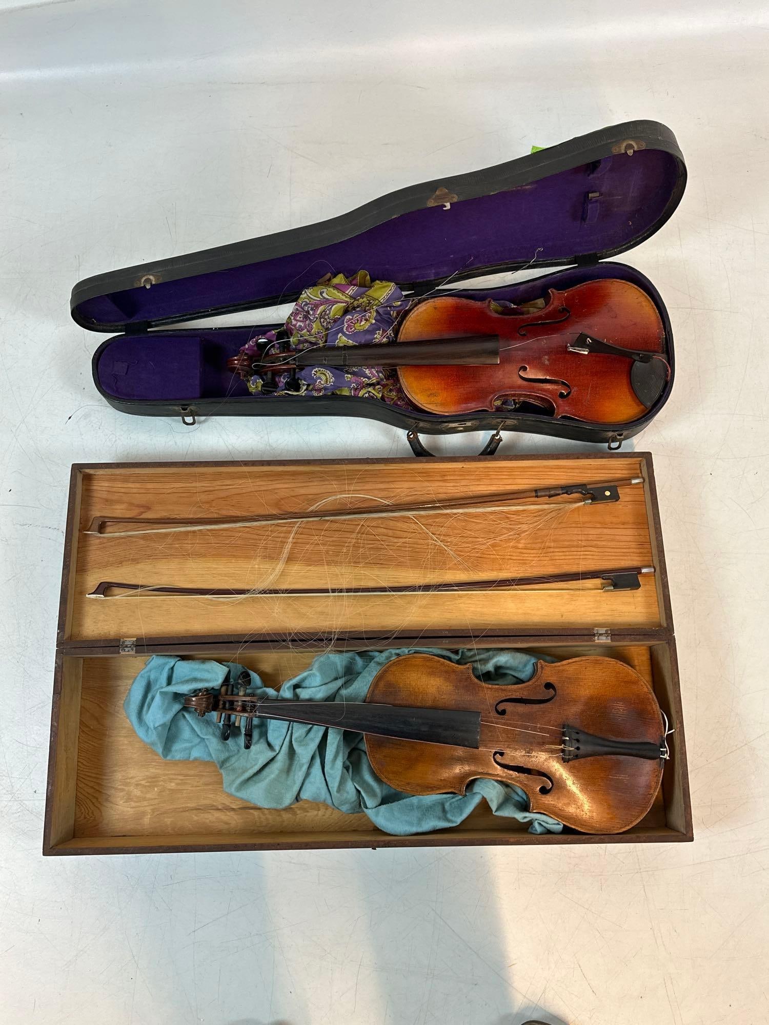 TWO VINTAGE ANTONIUS STRADIVARIUS COPY VIOLINS WITH CASES: Lot of two vintage acoustic violins, student-grade bench copies modeled after Antonius Stradivarius.Â Approximate Dimensions: 9.5â€x30â€ Artist or Maker: U