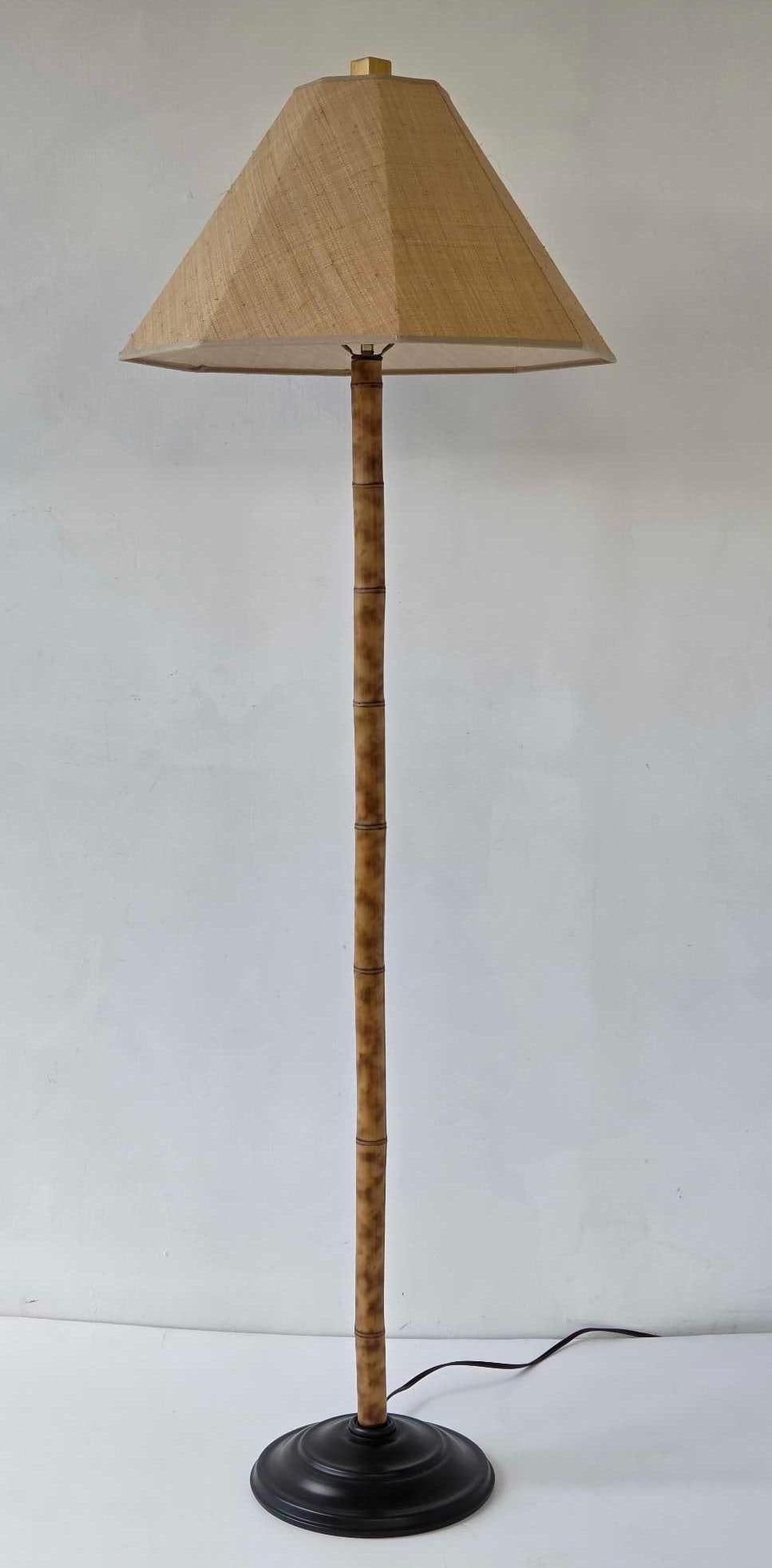 FINE BAMBOO FLOOR LAMP WITH GRASS CLOTH SHADE: Vintage Hollywood Regency style floor lamp with a bamboo standard with a hexagonal woven grasscloth shade. Approximate Dimensions: 62.5"h x 11"dia lamp base; Shade:12"h x 20.5"w x 20.5