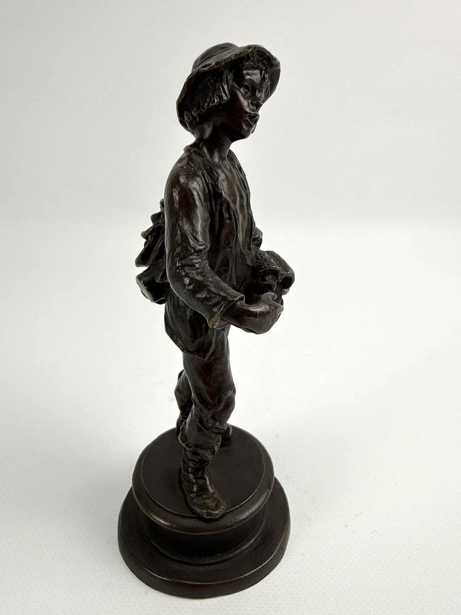 ANTIQUE PATINATED BRONZE FIGURE OF A BOY: *Small-scale patinated bronze sculpture depicting a young street urchin. Approximate Dimensions: 6” tall Artist or Maker: Unknown Provenance: From a New York Collector