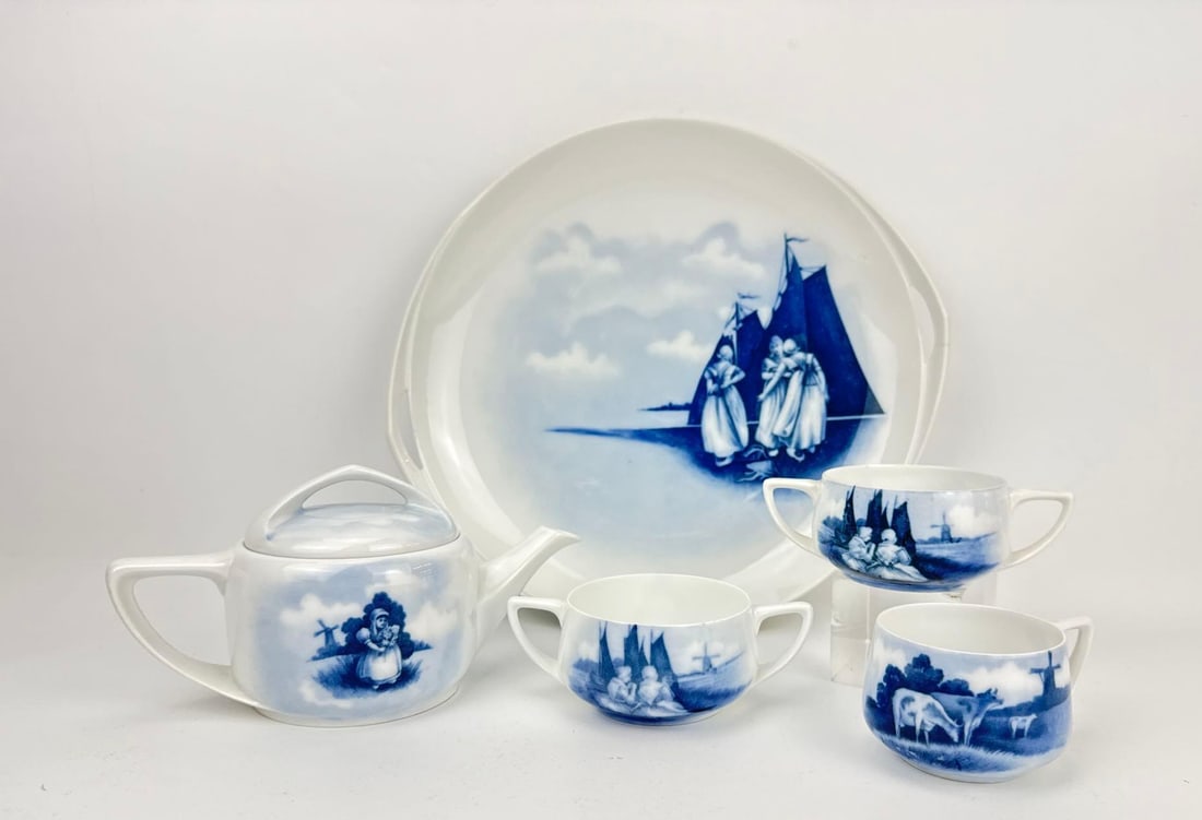 ANTIQUE ROSENTHAL BAVARIA "DONATELLO" BLUE AND WHITE PORCELAIN TEA SERVICE: Five-piece antique German porcelain tea or luncheon set manufactured by Rosenthal in the "Donatello" shape. Approximate Dimensions: Teapot: 4”h x 8”w x 4.75”d Artist or Maker