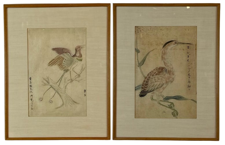 PAIR OF JAPANESE INK AND COLOR ON PAPER BIRD DRAWINGS: A matched pair of antique Japanese ink and light wash botanical studies depicting a heron and a long-tailed bird perched on branches with calligraphic inscriptions. Approximate Dimensions: 11”x7