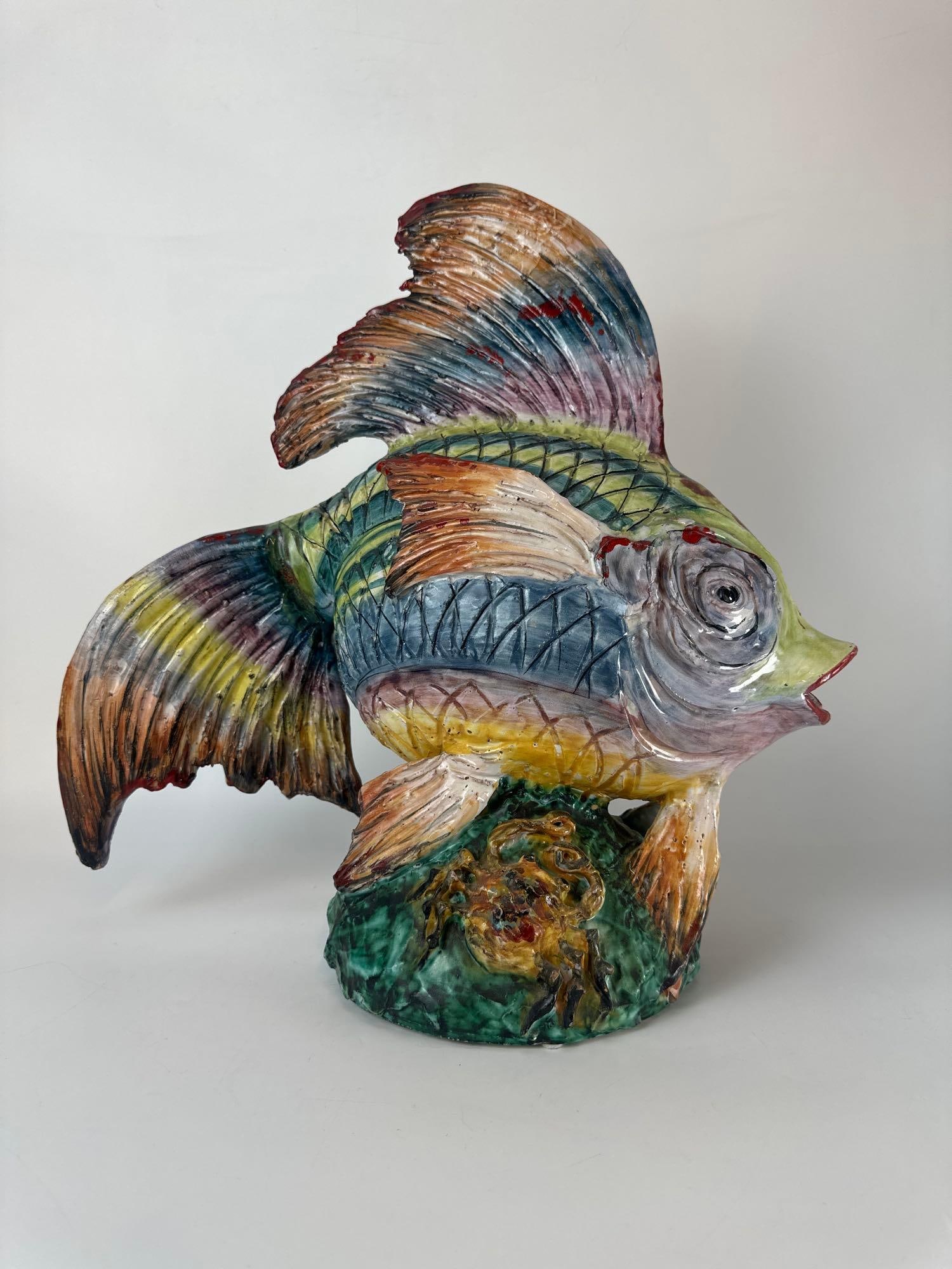 LARGE ITALIAN MAJOLICA CERAMIC FISH SCULPTURE: *A vibrant, hand-painted Italian Majolica pottery sculpture of a tropical fish, featuring a high-gloss glaze with multi-colored scales and fins, mounted on a coral and crab-motif base. Approximate Dim