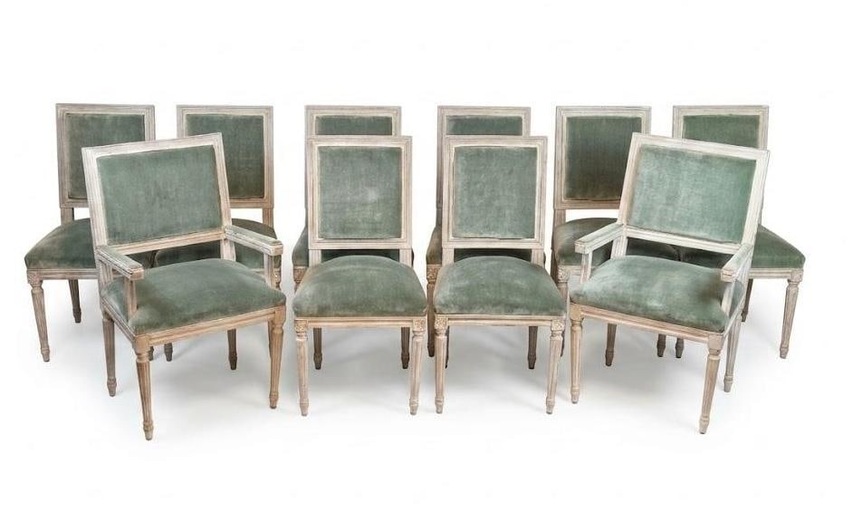 SET OF TEN LOUIS XVI STYLE VELVET UPHOLSTERED DINING CHAIRS TWO ARM EIGHT SIDE: A large set of ten (10) 20th-century Louis XVI style dining chairs comprising two (2) armchairs and eight (8) side chairs. Each features a carved beechwood frame with a distressed, whitewashed patinat