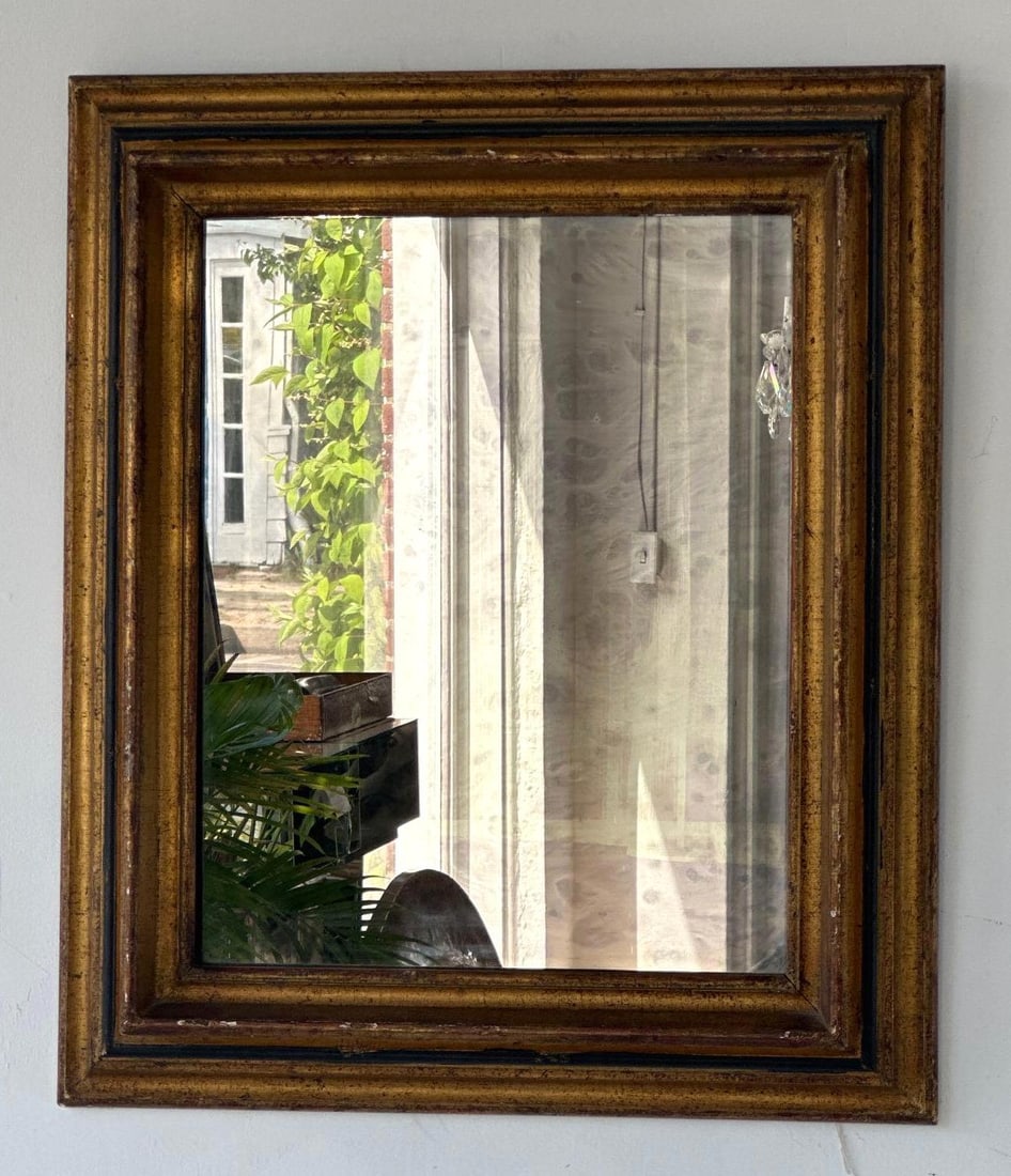 ANTIQUE GILT WOOD SQUARE WALL MIRROR WITH BLACK ACCENTS: A distressed gilt wood accent mirror with an ebonized trim band. Approximate Dimensions: 27" x 22" Artist or Maker: Unknown Provenance: From a New York collector. Notes: Although c