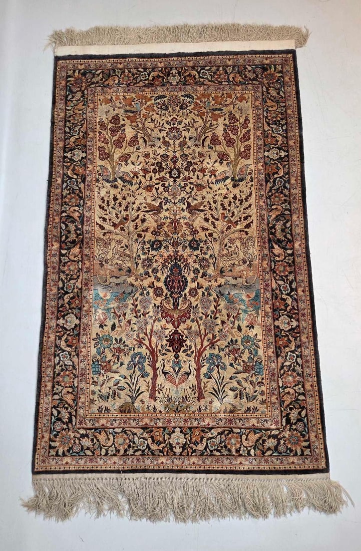 HAND KNOTTED SILK TREE OF LIFE AREA RUG: Fine hand woven pure silk accent rug decorated with an intricate Tree of Life pictorial design. Approximate Dimensions: 5' x 3'-1" Artist or Maker: Unknown Provenan