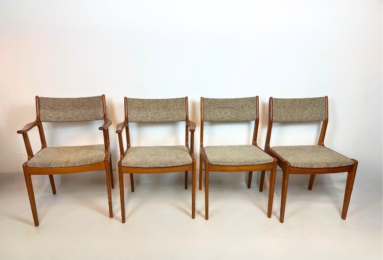 SET OF 4 MID CENTURY MODERN TEAK DINING CHAIRS: Set of four mid-century modern Danish style teak dining chairs including two armchairs and two side chairs upholstered in a textured neutral tweed fabric Approximate