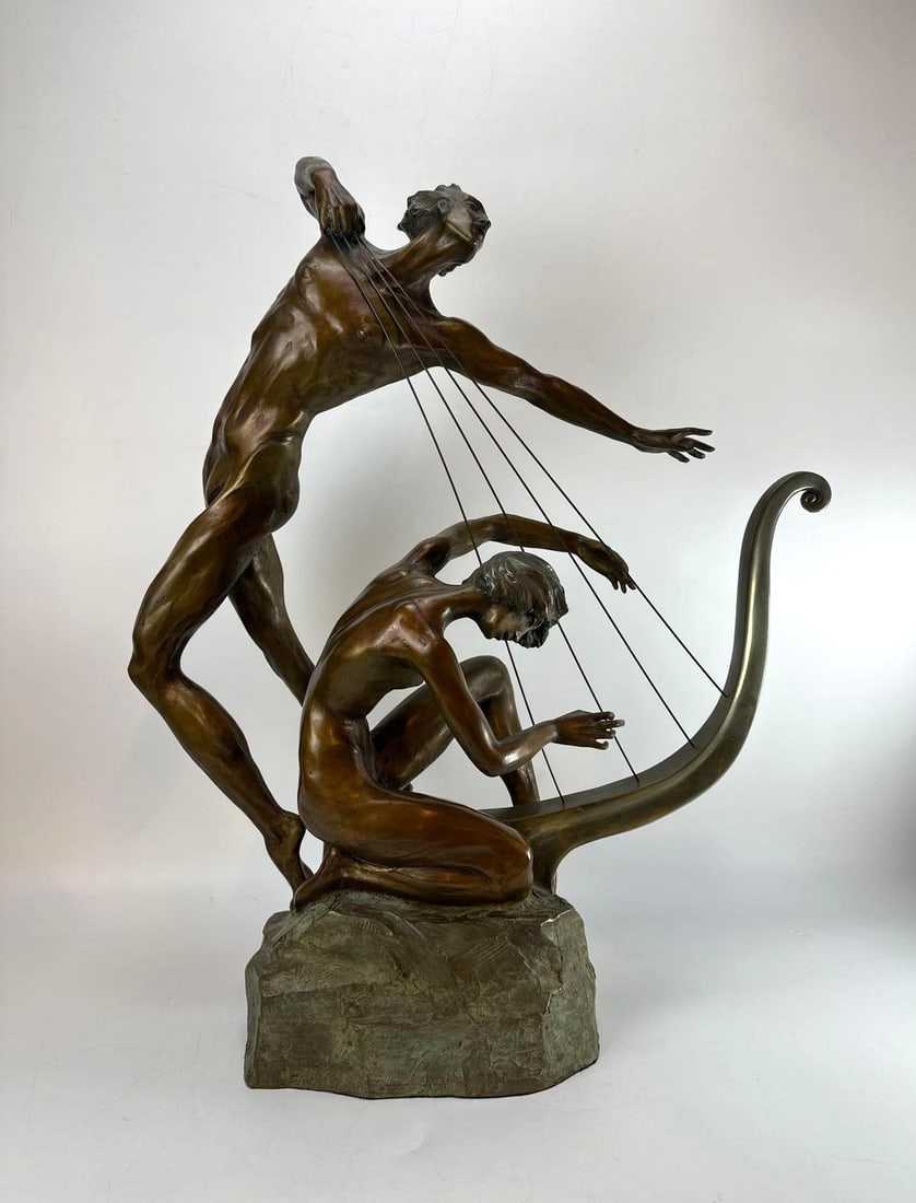HARP PLAYER BRONZE SCULPTURE MISHA FRID SIGNED AND NUMBERED111/195: A large, limited edition patinated bronze sculpture numbered 111/195, depicting stylized nude figures playing a harp on a rocky base. Approximate Dimensions: 22” x 9” x 26” Artist or