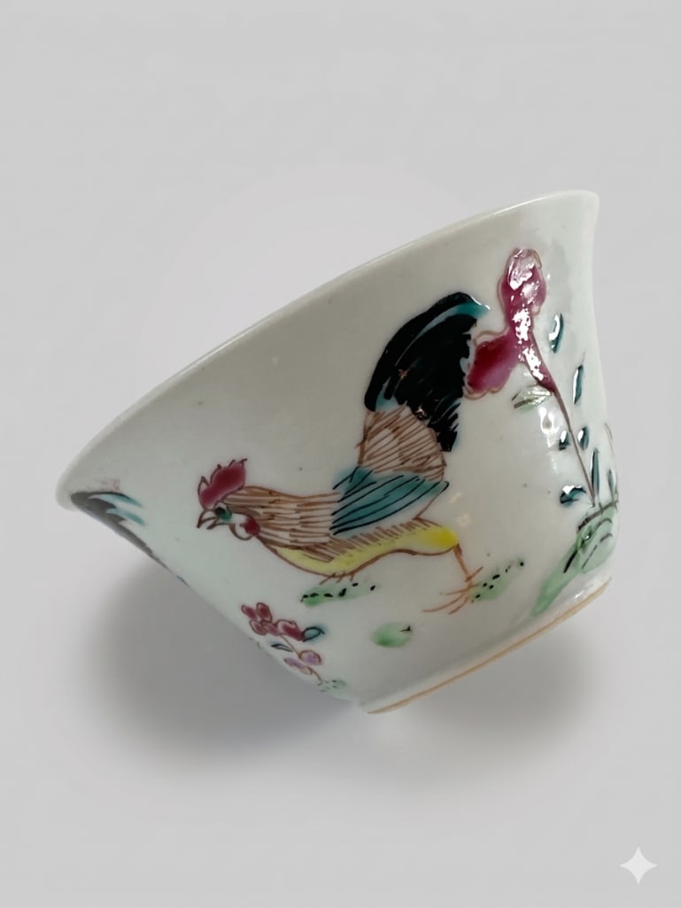CHINESE FAMILLE ROSE POUSSIN "CHICKEN" CUP IN CHENGHUA STYLE: Small conical porcelain tea cup hand-painted in the Doucai palette with roosters, hens, and chicks amidst stylized rockwork and foliage. An iron-red spurious six-character Chenghua reign mark, enclose