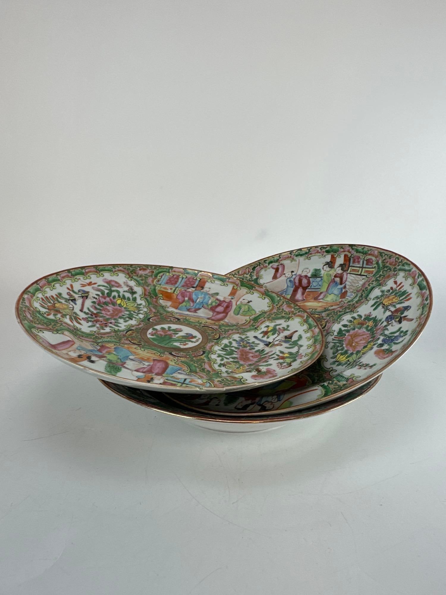 THREE ANTIQUE CHINESE EXPORT ROSE MEDALLION PORCELAIN SHALLOW BOWLS: A trio of late 19th-to-early 20th-century Chinese export porcelain deep plates or shallow bowls hand-painted in the traditional Rose Medallion pattern with alternating panels of courtyard figures and 