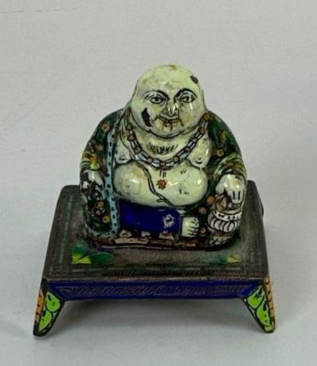 ANTIQUE CHINESE PAINTED ENAMEL SEATED BUDDHA FIGURE ON STAND: Small enamel-on-metal seated Buddai Buddha figure on footed stand Dimensions: 1.75”x1.5”x15/8” Artist or Maker: Unknown Provenance: Provenance: From the personal collection of