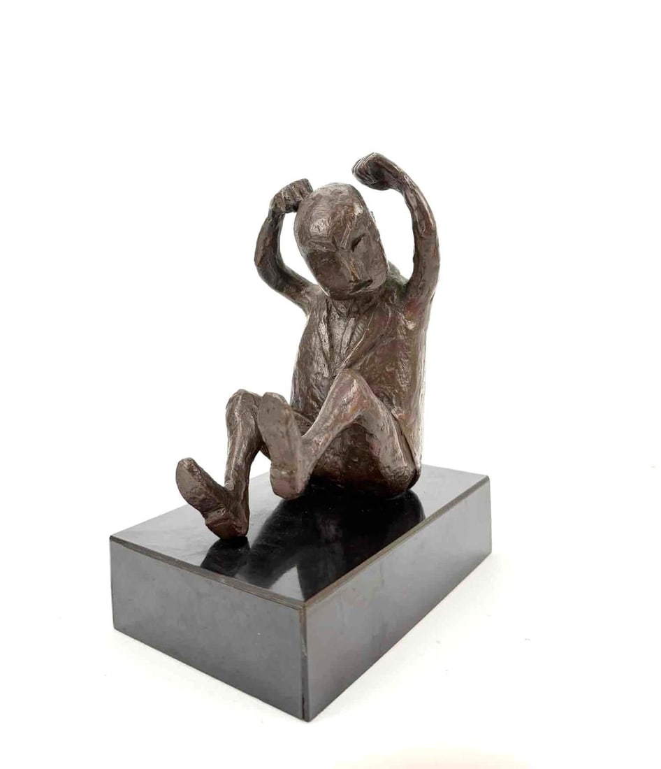 OLIVIA A. CALDER MORRISON (1909-2010, AMERICAN) FIGURAL BRONZE SCULPTURE: A mid-century modern cast bronze sculptural figure depicting a seated stylized person with raised arms, mounted to a polished dark stone rectangular plinth base. Approximate Dimensions: 8"H x 6