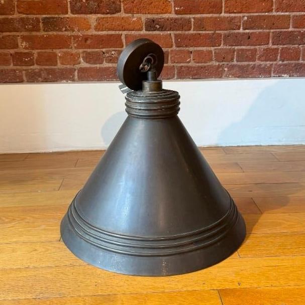 POSTMODERN VINTAGE INDUSTRIAL FACTORY PENDANT LIGHT – BRASS CONE WITH ART DECO BANDING DETAILS: Brass conical factory pendant warehouse style light with Art deco banding detail. Pick up Note: This lot located in Manhattan NYC, and must picked up in Manhattan. Estimated Approximate Dimensions: 18