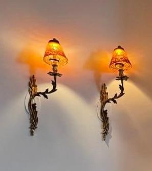 TWO GILT BRONZE ROCOCO GLASS WALL SCONCES WITH COLORED BEAD SHADES: Two gilt bronze French Rococo wall sconces, each featuring a distinct colored beaded glass shade, mounted on a decorative metal arm. From the Moschino NYC showroom. Dimensions: 21” x 9” Ar