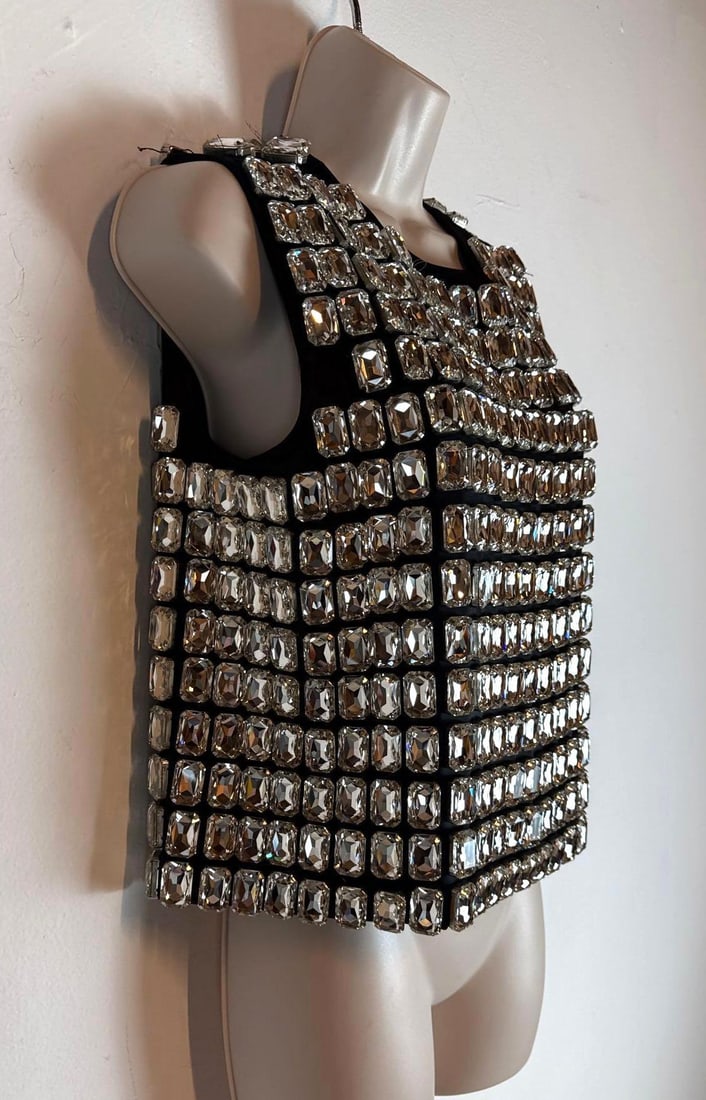 MOSCHINO COUTURE JEREMY SCOTT CRYSTAL EMBELLISHED CROPPED BLACK TANK TOP (2 OF 2) SAMPLE: A sleeveless crewneck crop top in black, entirely embellished with a grid pattern of large, faceted rectangular glass crystals. Note missing crystals and loose crystals in photos... Size: I-42 D-36 F-