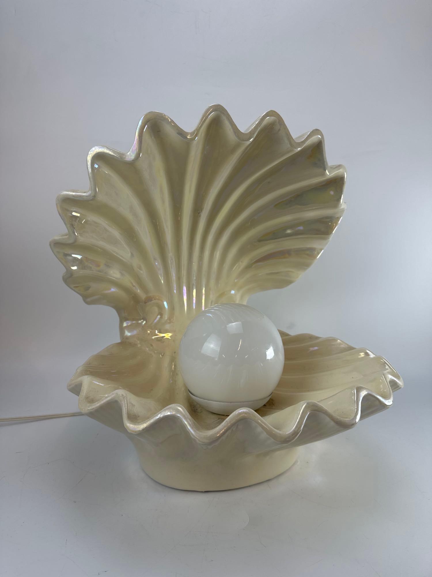 VINTAGE LIMELIGHT IRIDESCENT CERAMIC OYSTER CLAM SHELL TABLE LAMP WITH PEARL GLOBE: Large vintage pearlescent white glazed ceramic double-sided open oyster shell sculptural accent light on an oval base with a central spherical frosted white glass pearl orb globe illuminated from with