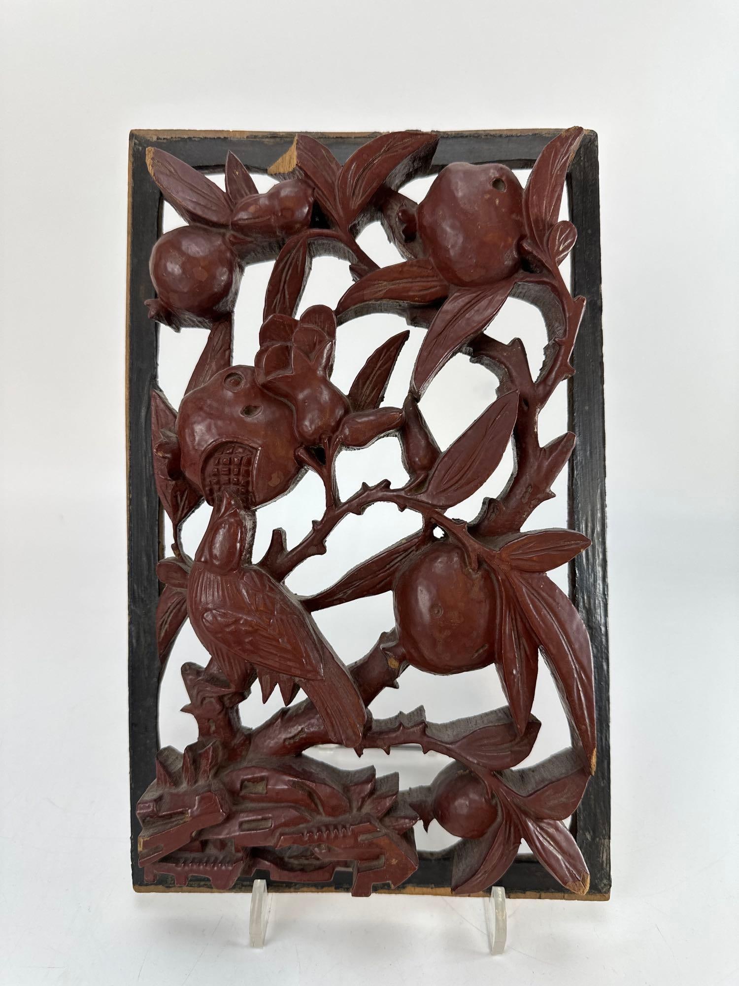 CHINESE HAND-CARVED WOODEN RELIEF PANEL WITH BIRDS AND FRUIT TREES: Antique Chinese rectangular openwork wooden wall panel decorated with deeply carved relief work depicting small birds perched among branches of a fruiting pomegranate tree Approximate Dimensions: 7.5&