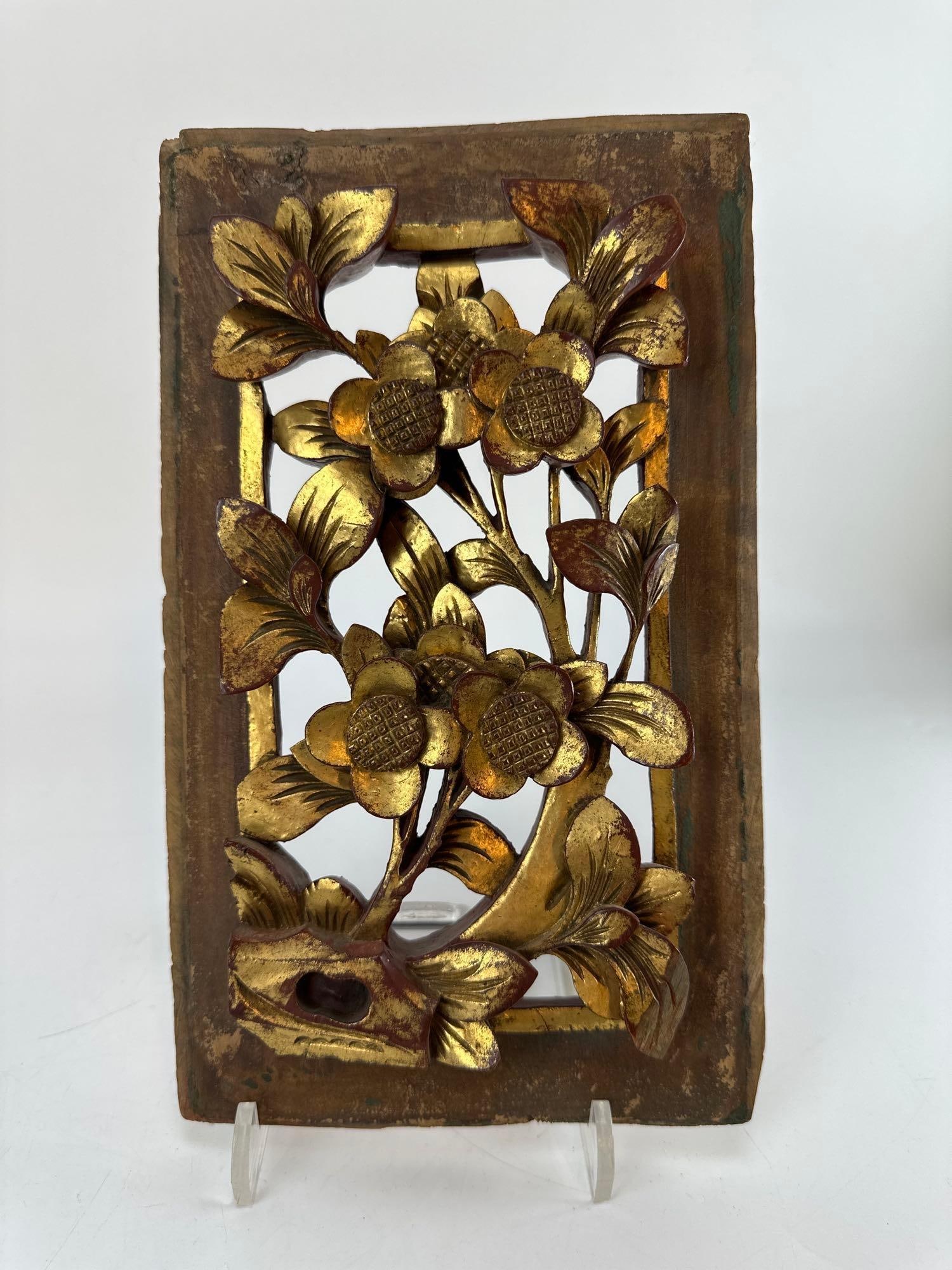 ANTIQUE CHINESE GILTWOOD FLORAL RELIEF SCREEN PANEL: Antique Chinese rectangular openwork wooden architectural panel heavily decorated with deeply carved high-relief floral blossoms and traditional gold gilt finish Approximate Dimensions: 6.5”x10.