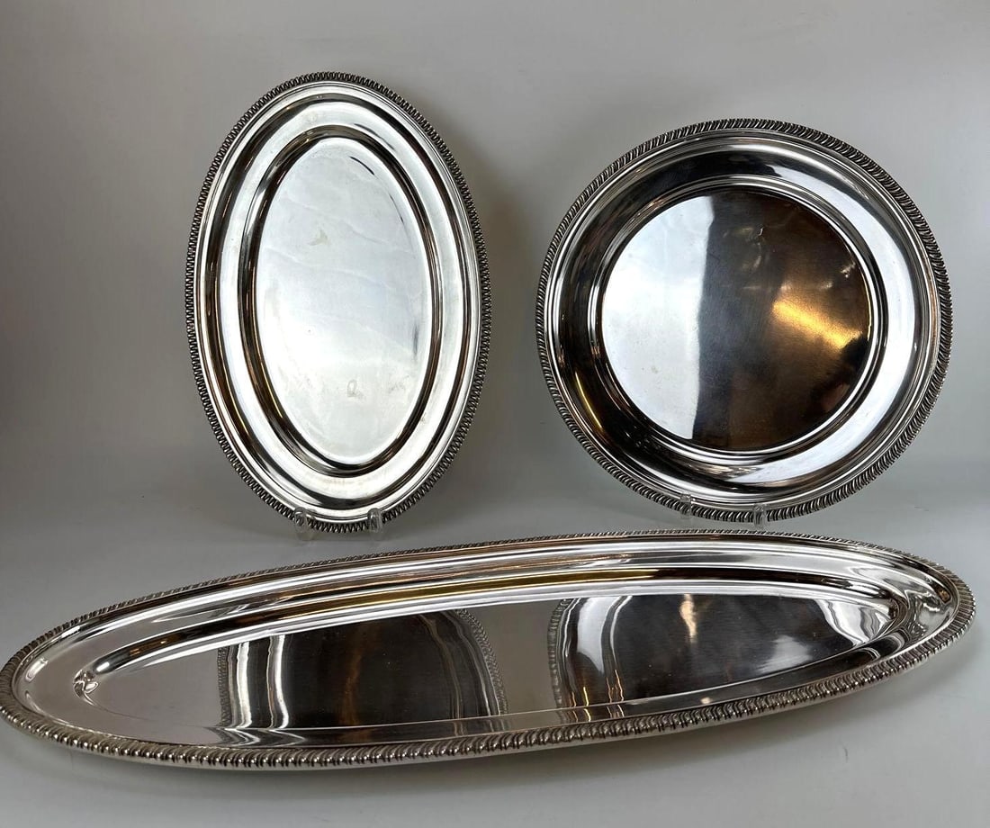 VINTAGE CHRISTOFLE SILVER-PLATE THREE-PIECE SERVING TRAY SET: An exceptional three-piece antique Christofle Argentine Production silver-plated serving tray set by the prestigious silversmith house Christofle. Approximate Dimensions Largest: 25” x 12”