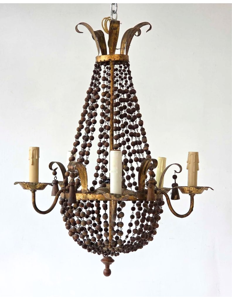 VINTAGE FRENCH STYLE GILT METAL AND WOOD BEAD FIVE LIGHT CHANDELIER: Hanging five-arm ceiling light fixture styled with tiered draped wooden bead strands and a distressed gold leaf finish. Approximate Dimensions: 25" h x 19" dia Artist or Maker: Unknown Provena