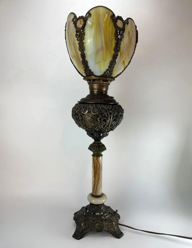 ANTIQUARIAN VICTORIAN PATINATED BRONZE BANQUET LAMP - ELECTRIFIED: Antique late 19th-century Victorian oil banquet lamp, now converted to electricity. Featuring a beautifully cast patinated bronze structure with an openwork floral urn body, an intricate architectural
