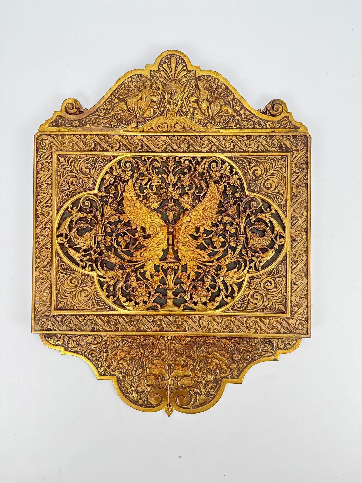 ANTIQUE 19TH CENTURY OTTOMAN EMPIRE BRASS PALASKA CARTRIDGE POUCH BOX: Ornate 19th-century Ottoman Turkish cast brass ammunition box with intricate openwork, scrolling foliage, and symmetrical winged figures centering an urn motif. Approximate Dimensions: 18” H X 1