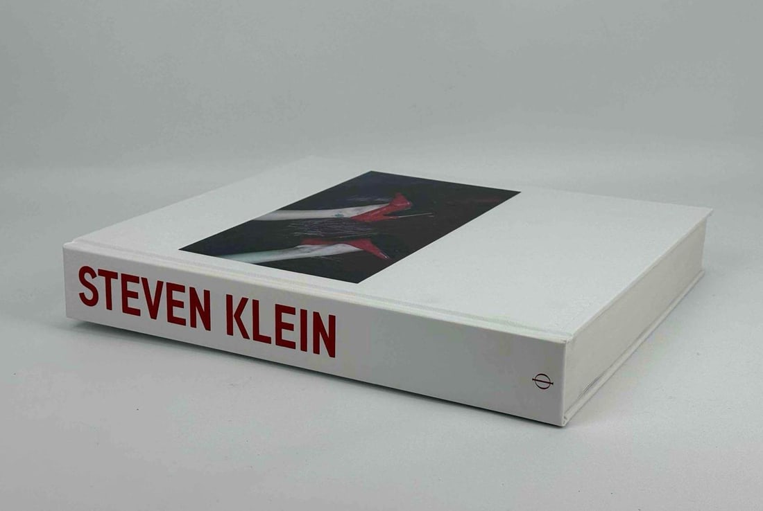 STEVEN KLEIN SIGNED FIRST EDITION PHAIDON PHOTOGRAPHY MONOGRAPH WITH BOX: Large format hardback contemporary fashion photography book boldly autographed by the artist on the front endpaper accompanied by original cardboard shipping carton. Approxima