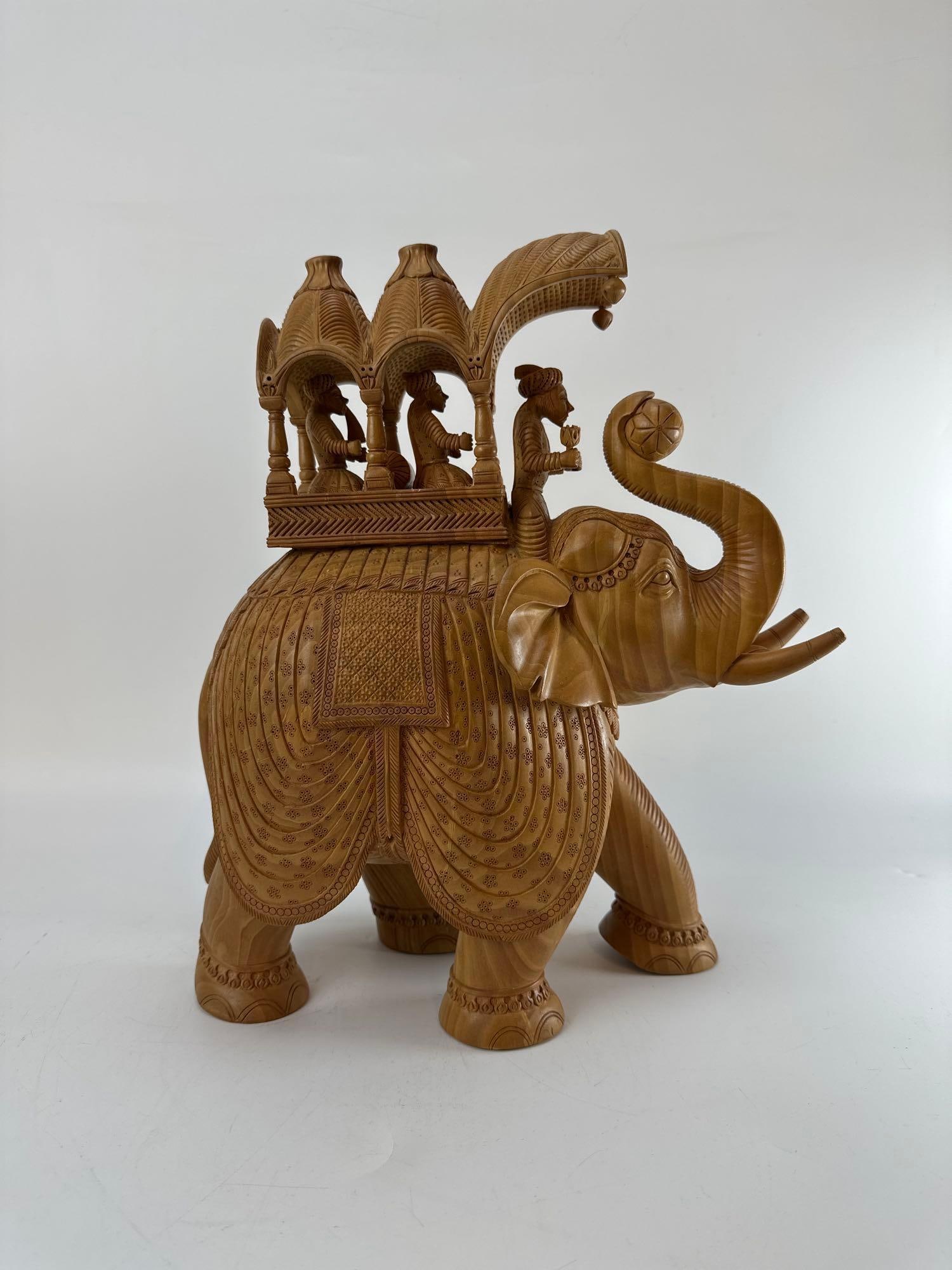 LARGE INDIAN AMBIBARI HAND-CARVED WOOD HOWDAH ELEPHANT SCULPTURE: *Finely detailed 20th-century Indian hand-carved openwork wood sculpture of a ceremonial caparisoned elephant carrying an elaborate domed howdah (carriage) with royal passengers and a mahout rider. Ap