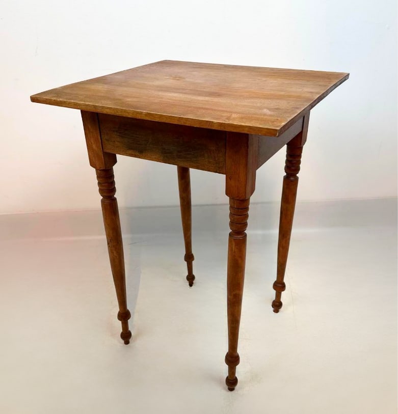 MID-ATLANTIC LATE FEDERAL WALNUT STAND TABLE: Antique square wooden side table crafted with a single flush drawer on turned legs ending in small peg feet. Approximate Dimensions: 19.5”L x 19”W x 26”H Artist or Maker: Unknown Pro