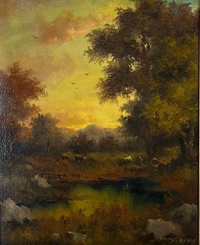 HENRY T HARVEY ANTIQUE HUDSON RIVER SCHOOL OIL LANDSCAPE PAINTING: Luminous late 19th-century American Barbizon style oil on canvas painting by Henry T. Harvey depicting grazing cattle near a tranquil pond under a dramatic golden sunset sky enclosed in an ornate gild