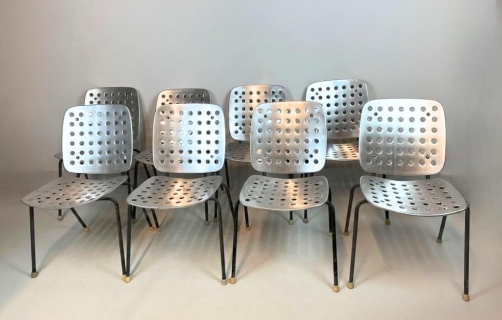 SET OF 8 VINTAGE HANS CORAY PERFORATED ALUMINUM STACKING CHAIRS: A set of eight vintage mid-century modern stacking dining or garden chairs featuring perforated sheet aluminum seats and backs on black tubular metal frames designed by Hans Coray. Approximate Dimensi