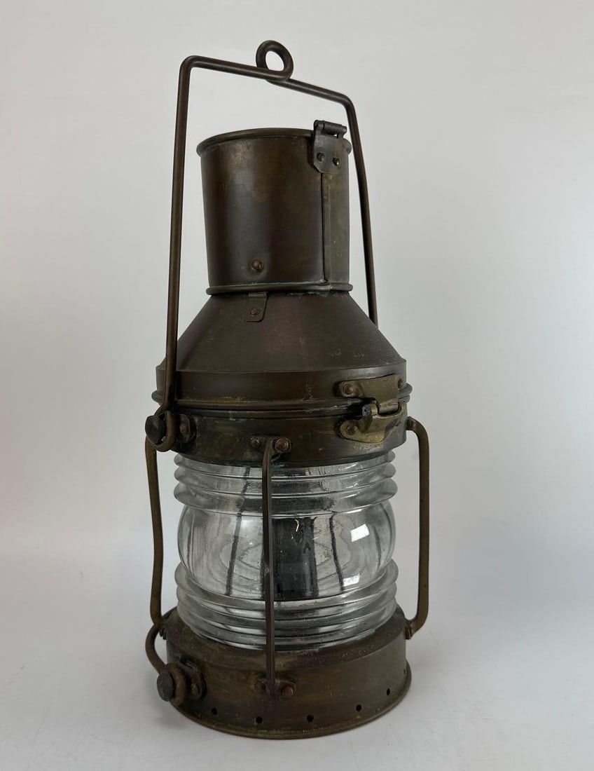 VINTAGE ANCHOR BRAND COPPER AND BRASS MARITIME SHIPS ANCHOR LANTERN WITH FRESNEL LENS: Vintage heavy-gauge sheet copper nautical masthead anchor ship's lantern fitted with solid brass hardware reinforcements, a classic clear ribbed glass Fresnel lighthouse style lens, a swing bail h