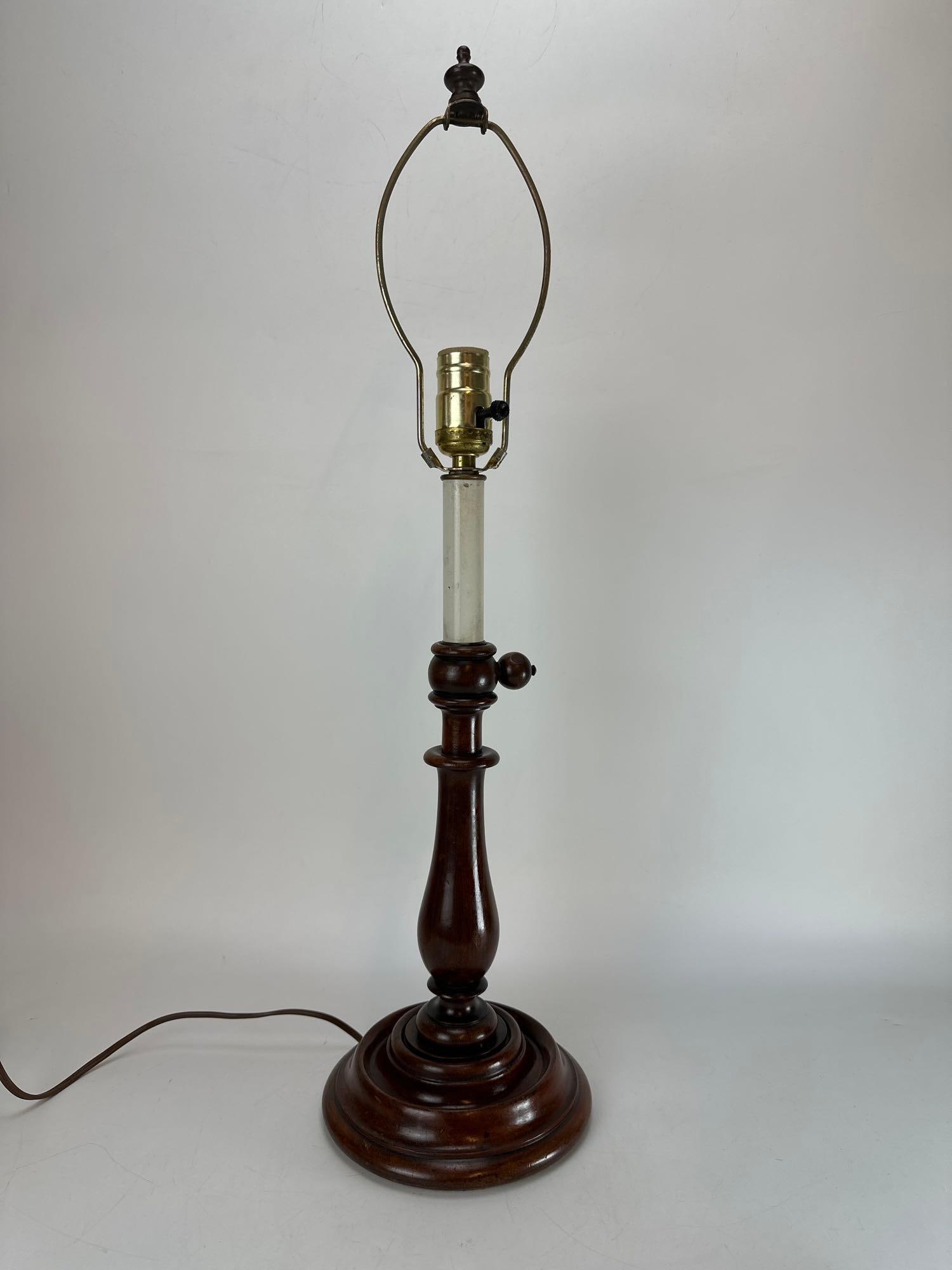 VINTAGE STAINED MAHOGANY TURNED WOOD BALUSTER TABLE LAMP: Late 20th century traditional table lamp crafted from turned wood with a deep stained mahogany finish, designed with a classic baluster candlestick profile on a tiered circular base, complete with a b