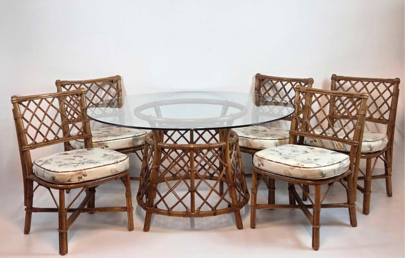 VINTAGE RATTAN DINING SET TABLE AND FIVE CHAIRS: Six-piece casual dining suite composed of a circular glass-top table on a split bamboo pedestal base paired with five coordinating woven open-back armchairs Approximate Dimensions: Table: 29" H X 