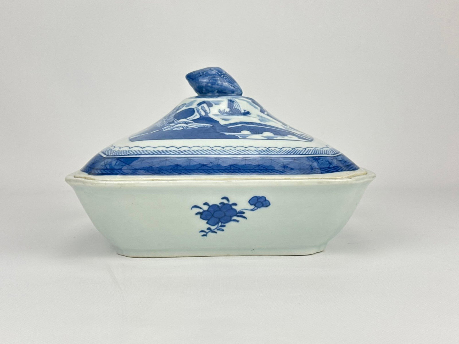 19TH-C CHINESE EXPORT BLUE CANTON PORCELAIN COVERED TUREEN: Antique underglaze blue and white Chinoiserie landscape patterned rectangular vegetable serving vessel with matching lid. Approximate Dimensions: 9 x 8 x 2.5” without lid (w/ lid +3”) 