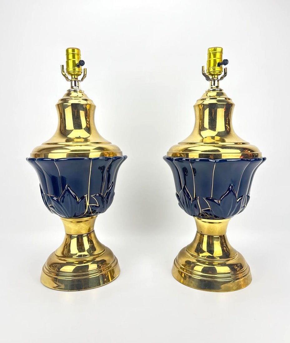 PAIR OF VINTAGE COBALT BLUE AND GOLD URN TABLE LAMPS: A matching pair of classical urn form table lamps with cobalt blue glazed ceramic midsections accented by sculpted lotus leaves and heavy polished brass bases and caps. Approximate Dimensions: 20&rdqu
