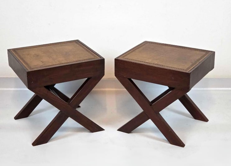 PAIR OF EMBOSSED LEATHER TOP X LEG BENCHES/ TABLES: A pair of mid-century, campaign style stools with embossed brown leather inset tops on cross-stretchered X-frame bases. Approximate Dimensions: 16" H x 16" W x 14" D Artist or Maker: