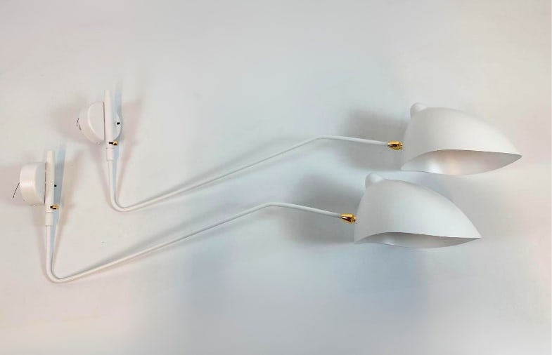 PAIR OF SERGE MOUILLE STYLE ROTATING ONE-ARM WALL SCONCES - CONTEMPORARY, NEW CONDITION IN BOXES: Pair of rotating wall sconces with one curved arm, in the style of Serge Mouille. Never used. Features a steel arm ending in a rotating aluminum shade with white interior for diffused light, adjustabl