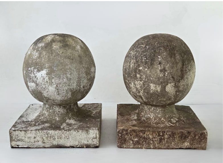 PAIR OF ANTIQUE STYLE WEATHERED CAST STONE CONCRETE GARDEN FINIAL SPHERES: Pair of vintage architectural cast concrete garden finials resting on square plinth bases with a heavily weathered, mossy stone patina Approximate Dimensions: 19.5" H X 15.25" W X 16.25" A