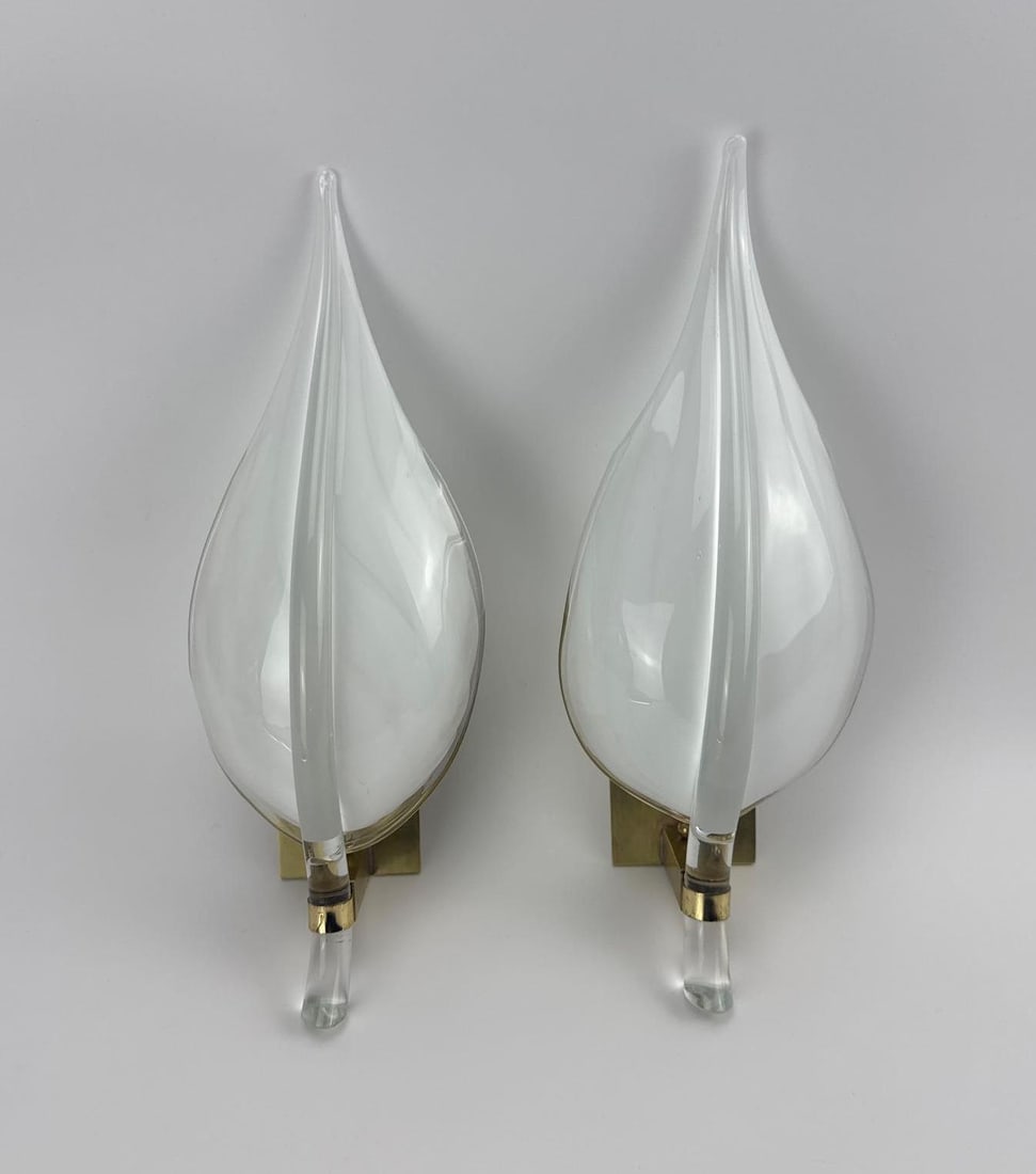 PAIR OF MID-CENTURY MURANO FRANCO LUCE GLASS LEAF SCONCES: Pair of vintage Italian mid-century modern wall sconces designed by Franco Luce, featuring large, hand-blown Murano glass leaf or feather-form shades with a clear and frosted finish, mounted on polish