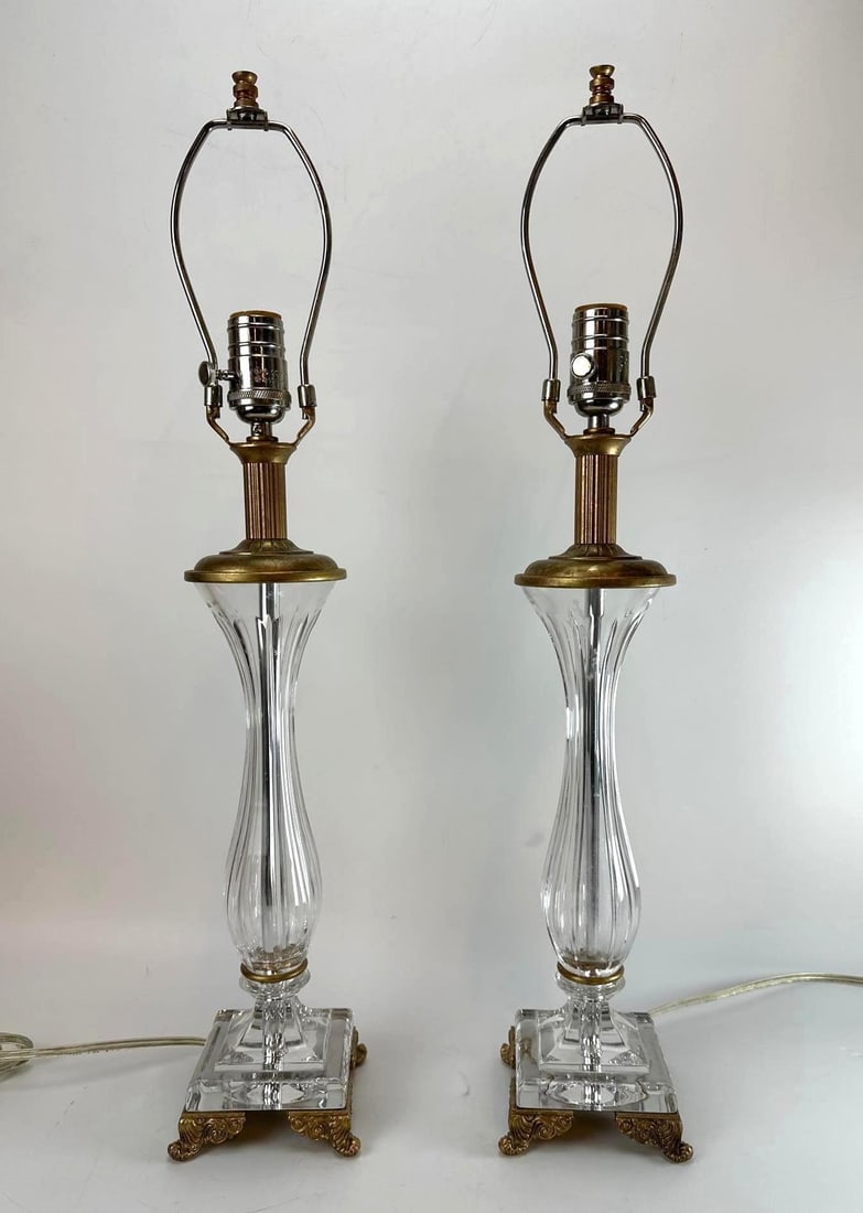 PAIR OF VINTAGE BACCARAT STYLE FLUTED CRYSTAL & BRASS TABLE LAMPS: *A matching pair of traditional Hollywood Regency style table lamps with ribbed column bodies on ornate square cast brass scroll-footed bases. Approximate Dimensions: 25"H x 5”W x 5”D 