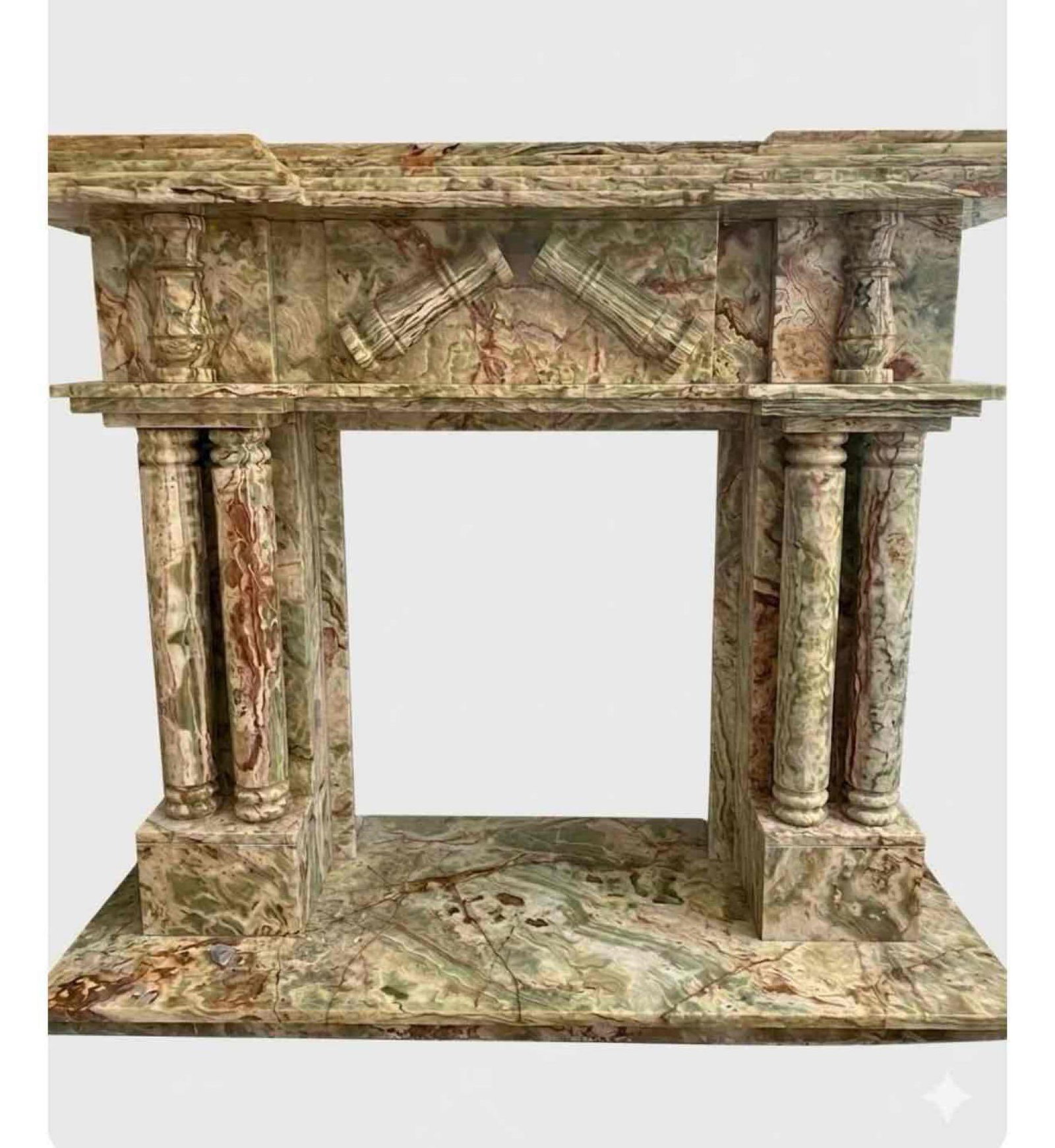 NEOCLASSICAL ITALIAN STYLE GREEN ONYX FIREPLACE MANTEL: *A dismantled multi-piece architectural natural green onyx stone hearth surround comprising a stepped mantel shelf, twin double-column side plinths, and a decorative ribbon-scroll relief back panel. A