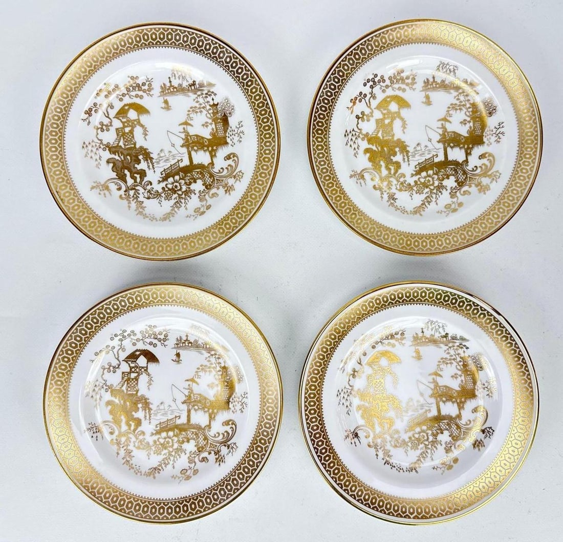 SET OF FOUR SPODE COPELAND CHINA GOLD AND WHITE "SPODE'S GARDEN" PLATES: *Set of four English porcelain plates with stylized Willow central design and a gilt ruyi-style honeycomb border and a central gold Chinoiserie landscape motif. Approximate Dimensions: .75” H x