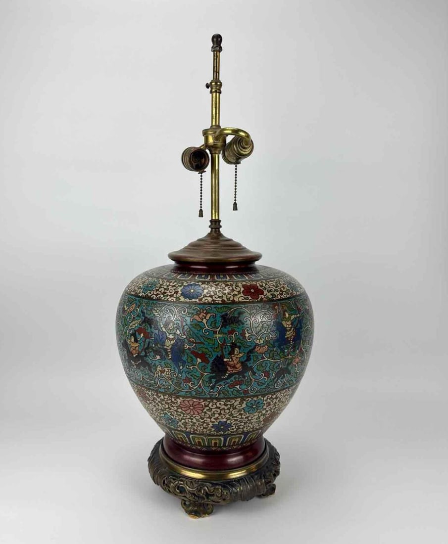 JAPANESE CLOISONNÉ ENAMEL GINGER JAR TABLE LAMP FEATURING EQUESTRIAN FIGURES: Japanese cloisonné enamel ginger jar form table lamp decorated with figures on horseback and intricate floral scrollwork, raised on a pierced cast metal footed base Approximate Dimensions: 27” 