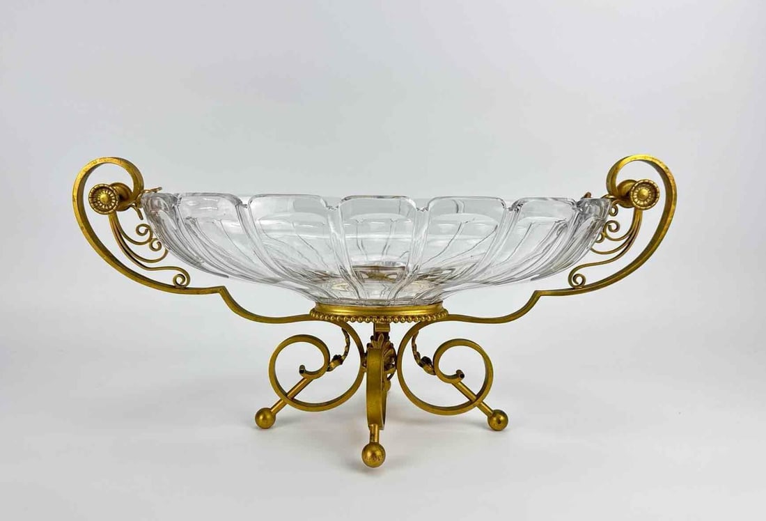 FRENCH GILT BRONZE MOUNTED CUT CRYSTAL CENTERPIECE BOWL ATTRIBUTED TO BACCARAT: Impressionable late 19th or early 20th century French Neoclassical style crystal and gilt bronze (ormolu) centerpiece bowl, attributed to Baccarat. Approximate Dimensions: 9.75” H X 20” W 
