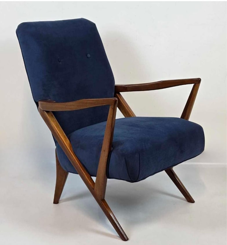 MID CENTURY UPHOLSTERED WALNUT ARM CHAIR ATTRIBUTED TO GIUSEPPE SCAPINELLI: Mid-century modern lounge armchair attributed to Giuseppe Scapinelli, featuring a sculpted walnut frame with dynamic angular armrests and splayed legs. Approximate Dimensions: 34.25" H X 26" W