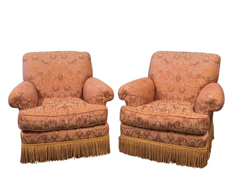 PAIR OF OVERSTUFFED UPHOLSTERED DOWN-CUSHION ARMCHAIRS WITH FRINGE TRIM: Pair of plush, overstuffed club armchairs featuring rolled arms with ruched detail, down-filled seat cushions, pattern-matched terracotta and gold damask woven upholstery with bird and floral motifs, 